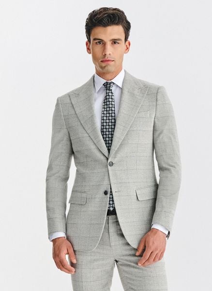 PAKO LORENTE – Szara marynarka garniturowa w kratkę. Szare garnitury męskie Pako Lorente, bez wzorów, z elastanu, bez kołnierzyka, bez ramiączek. Za 799.99 zł.