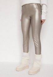 Szampańskie Legginsy z Ekoskóry z Guzikami Wysokim Stanem i Gumką w Talii Sintheria. Żółte legginsy damskie Born2be, z aplikacjami, z jeansu. Za 29.99 zł.