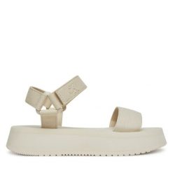 Sandały Calvin Klein Jeans. Sandały damskie Calvin Klein Jeans, bez wzorów, z jeansu, bez obcasa, na koturnie, bez zapięcia. Za 229.99 zł.