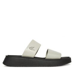 Klapki Calvin Klein Jeans. Białe klapki damskie Calvin Klein Jeans, bez wzorów, z jeansu, bez obcasa, bez zapięcia. Za 219.99 zł.