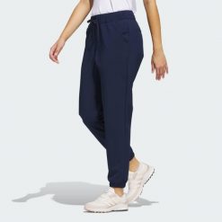 Spodnie dresowe Women's Ultimate365. Czarne spodnie dresowe damskie Adidas, bez wzorów, z dresówki, sportowe, na golfa. Za 329.00 zł.