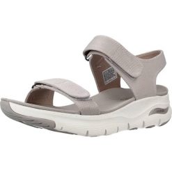 Sandały Skechers Model Arch Fit Touristy Kolor Beżowy. Brązowe sandały damskie Skechers, bez wzorów, z tkaniny, bez obcasa, bez zapięcia. Za 340.45 zł.