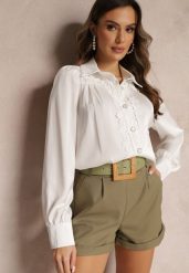 Biała Koszula z Koronkowymi Wstawkami i Ozdobnymi Guzikami Herinna. Białe koszule damskie Renee, m, bez wzorów, z koronki, eleganckie, bez kołnierzyka, bez ramiączek. Za 69.99 zł.