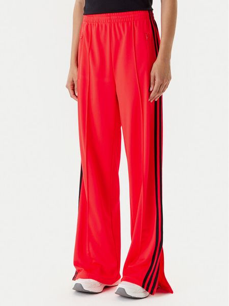 Adidas Spodnie dresowe adicolor Classic Firebird JW1227 Pomarańczowy Loose Fit. Brązowe spodnie dresowe damskie Adidas, bez wzorów, z dresówki. Za 219.99 zł.