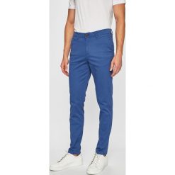Jack & Jones - Spodnie Marco. Niebieskie spodnie materiałowe męskie Jack & Jones, bez wzorów, z bawełny. W wyprzedaży za 89.90 zł.