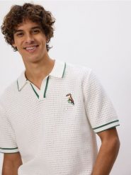 Ażurowy sweter polo - złamana biel. Swetry męskie Reserved, l, w ażurowe wzory, z bawełny, bez kołnierzyka, bez ramiączek. Za 139.99 zł.