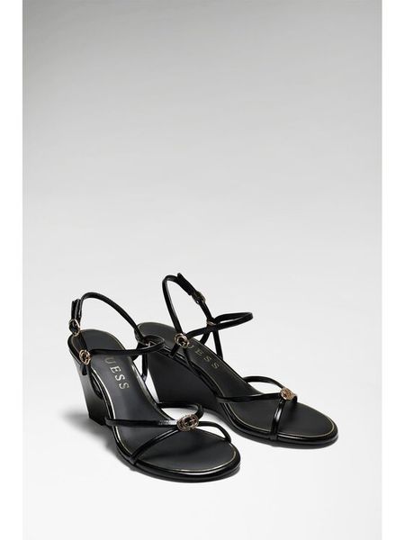 Guess Sandały FLTDVV PAF04 Czarny. Czarne sandały damskie Guess, z aplikacjami, ze skóry, bez obcasa, na koturnie, bez zapięcia. Za 358.99 zł.