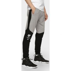 Spodnie dresowe męskie SPMD205 - szary melanż. Szare spodnie sportowe męskie 4F, m, bez wzorów, z dresówki. Za 149.99 zł.
