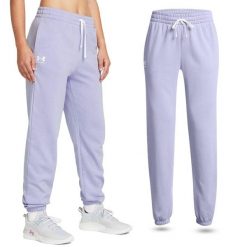 Spodnie dresowe damskie Under Armour Rival Terry Joggers joggery. Fioletowe spodnie dresowe damskie Under Armour, bez wzorów, z dresówki, sportowe, długie. W wyprzedaży za 227.45 zł.