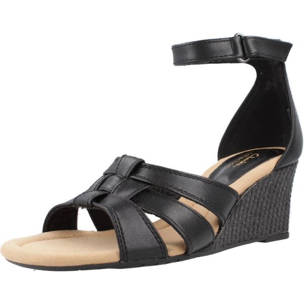 Sandały CLARKS KYARRA JOY Czarny. Czarne sandały damskie Clarks, bez wzorów, ze skóry, bez obcasa, bez zapięcia. Za 198.99 zł.