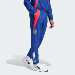 Spodnie Spain Tiro 24 Competition Presentation. Czerwone spodnie sportowe męskie Adidas, xs, bez wzorów, z dresówki, do piłki nożnej. W wyprzedaży za 203.50 zł.