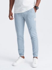 Spodnie męskie dresowe ze strukturalnej dzianiny - jasnoniebieskie V4 OM-PASK-0211 - XXL. Niebieskie spodnie sportowe męskie Ombre Clothing, l, z aplikacjami, z bawełny. Za 143.99 zł.