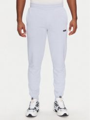 Puma Spodnie dresowe Ess 684714 Fioletowy Regular Fit. Fioletowe spodnie sportowe męskie Puma, m, bez wzorów, z bawełny. Za 129.99 zł.