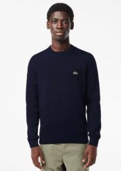 Klasyczny sweter Lacoste granatowy z okrągłym dekoltem. Niebieskie swetry męskie Lacoste, l, bez wzorów, z bawełny, klasyczne, bez kołnierzyka, bez ramiączek. Za 634.05 zł.
