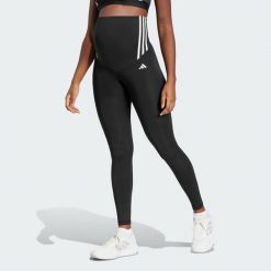 Legginsy Optime Essentials Full-Length (Maternity). Czarne legginsy damskie Adidas, bez wzorów, z materiału. W wyprzedaży za 114.50 zł.