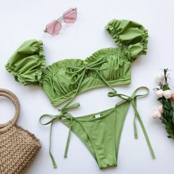 Bikini z rękawkiem na lato z trwałego materiału Saskia. Czarne bikini Intica, m, bez wzorów, z materiału. Za 139.00 zł.