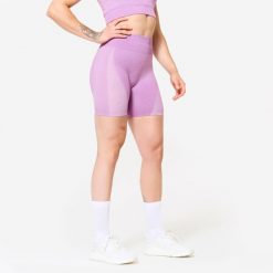 Spodenki fitness cardio damskie Domyos seamless. Czerwone obuwie sportowe damskie DOMYOS, bez wzorów, z materiału, bez zapięcia, na fitness i siłownię. W wyprzedaży za 59.99 zł.