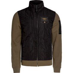 Bluza AERONAUTICA MILITARE. Zielone bluzy męskie Aeronautica Militare, na lato, bez wzorów, z nylonu, militarne, bez ramiączek, bez kaptura. W wyprzedaży za 550.00 zł.