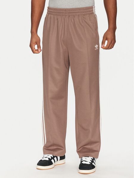 Adidas Spodnie dresowe adicolor Firebird JP1067 Beżowy Baggy Fit. Brązowe spodnie sportowe męskie Adidas, m, bez wzorów, z bawełny. Za 209.99 zł.