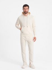 Męski dresowy komplet bluza kangurka + spodnie – kremowy V11. Białe spodnie materiałowe męskie Ombre Clothing, z aplikacjami, z bawełny. W wyprzedaży za 164.99 zł.