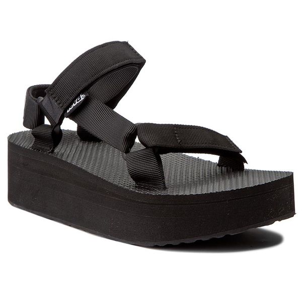 Sandały Teva. Czarne sandały damskie Teva, bez wzorów, bez obcasa, na koturnie, bez zapięcia. Za 222.99 zł.