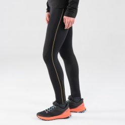 Legginsy do biegania w terenie damskie Kiprun Run 900. Czarne legginsy damskie EVADICT, bez wzorów, z materiału. Za 149.99 zł.