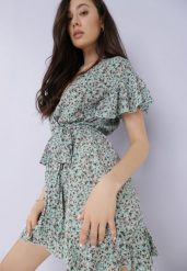 Niebieska Sukienka Asteriope. Niebieskie sukienki damskie Born2be, m, z aplikacjami, eleganckie, bez kołnierzyka, bez ramiączek, mini, kopertowe. Za 29.99 zł.