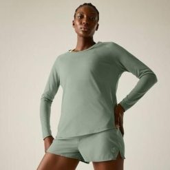 Damska koszulka z długim rękawem do biegania Nimble. Zielone bluzki damskie Dare 2B, bez wzorów, z lyocellu, sportowe, bez kołnierzyka, bez ramiączek. Za 137.20 zł.