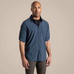 Koszula podróżnicza męska Craghoppers NosiLife Nuoro LS Shirt II. Niebieskie koszule męskie Craghoppers, na lato, m, bez wzorów, casualowe, bez kołnierzyka, bez ramiączek. W wyprzedaży za 351.85 zł.