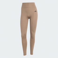 Legginsy Optimé Essentials No Front Rise Seam 7/8. Brązowe legginsy damskie Adidas, bez wzorów, z elastanu. Za 219.00 zł.