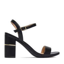 Sandały JENNY. Czarne sandały damskie Jenny, bez wzorów, bez obcasa, na słupku, bez zapięcia. Za 129.99 zł.