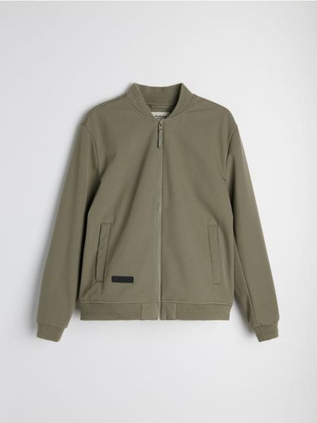 Kurtka softshell bomber - zielony. Zielone kurtki męskie Sinsay, l, bez wzorów, z softshellu, bez kaptura. Za 99.99 zł.