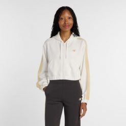Bluza damska New Balance WJ61B759SST – beżowa. Brązowe bluzy damskie New Balance, s, bez wzorów, z dresówki, bez ramiączek, z kapturem. Za 299.99 zł.