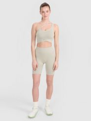 4F Legginsy kolarki bezszwowe treningowe damskie - beżowe XS/S. Brązowe legginsy damskie 4F, bez wzorów. W wyprzedaży za 59.99 zł.