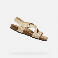 Sandały GEOX D BRIONIA Złoty. Żółte sandały damskie Geox, bez wzorów, ze skóry, bez obcasa, bez zapięcia. Za 349.99 zł.