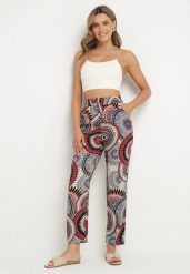 Czerwone Bawełniane Spodnie o Szerokim Kroju z Wysokim Stanem ze Wzorem Boho Zarrive. Czerwone spodnie materiałowe damskie Born2be, bez wzorów, z bawełny, boho, z podwyższonym stanem. Za 29.99 zł.