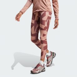 Legginsy Terrex Multi Printed. Brązowe legginsy damskie Adidas, bez wzorów, z materiału. W wyprzedaży za 244.30 zł.