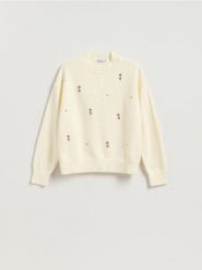 Sweter z ozdobnymi aplikacjami - kremowy. Białe swetry nierozpinane damskie Reserved, l, z aplikacjami, z dzianiny, bez kołnierzyka, bez ramiączek. Za 139.99 zł.