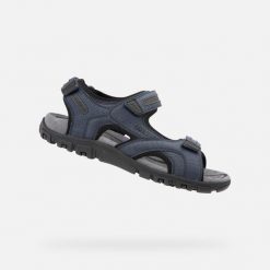 Sandales Geox Bleu. Niebieskie buty zimowe męskie Geox, bez wzorów, bez obcasa, bez zapięcia. Za 338.50 zł.