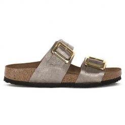 Klapki damskie Birkenstock Sydney. Żółte klapki damskie Birkenstock, na lato, bez wzorów, z materiału, bez obcasa, bez zapięcia. Za 666.00 zł.