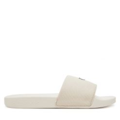 Klapki Calvin Klein Jeans. Klapki damskie Calvin Klein Jeans, bez wzorów, z jeansu, bez obcasa, bez zapięcia. Za 129.99 zł.