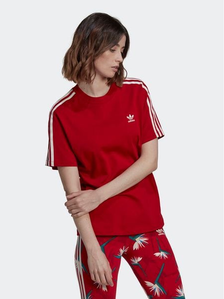 Adidas T-Shirt THEBE MAGUGU HK5209 Czerwony Regular Fit. Czerwone t-shirty damskie Adidas, bez wzorów, z bawełny, bez kołnierzyka, bez ramiączek. Za 119.99 zł.