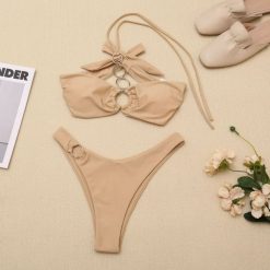Bikini z ozdobnymi kółeczkami na plażę Here. Zielone bikini Intica, bez wzorów. Za 109.00 zł.