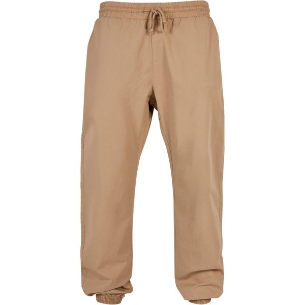 Damski strój do joggingu Urban Classics Basic. Brązowe spodnie dresowe damskie Urban Classics, bez wzorów, z dresówki, sportowe, długie, do biegania. Za 229.00 zł.