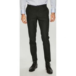 Jack & Jones - Spodnie. Czarne spodnie materiałowe męskie Jack & Jones, bez wzorów, z elastanu. W wyprzedaży za 139.90 zł.