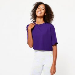 Koszulka damska Domyos Gym & Pilates crop top. Niebieskie bluzki damskie DOMYOS, m, bez wzorów, z bawełny, sportowe, bez kołnierzyka, bez ramiączek. Za 49.99 zł.