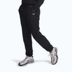 Spodnie damskie Under Armour Sport Terry Jogger /. Czarne spodnie sportowe damskie Under Armour, bez wzorów, sportowe, na fitness i siłownię. Za 159.99 zł.