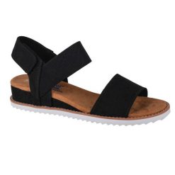 Sandały Skechers Model Desert Kiss Kolor Czarny. Czarne sandały damskie Skechers, bez wzorów, z tkaniny, bez obcasa, bez zapięcia. Za 199.99 zł.