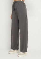 Ciemnoszare Spodnie z Gumką w Pasie i Wsuwanymi Kieszeniami Tosille. Szare spodnie materiałowe damskie Born2be, bez wzorów, z jeansu, eleganckie. Za 69.99 zł.