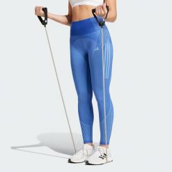 Legginsy Seamless Branded 7/8. Niebieskie legginsy damskie Adidas, bez wzorów, z materiału. Za 207.75 zł.